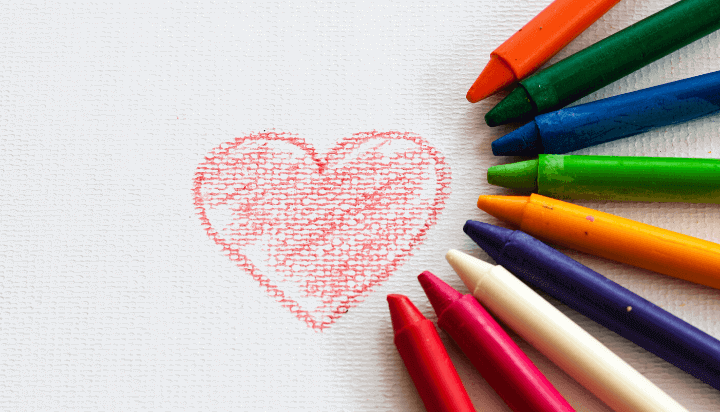 drawing of heart with half circle of crayons