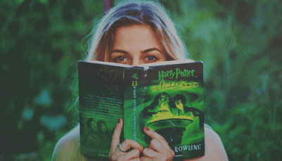 woman reading harry potter book