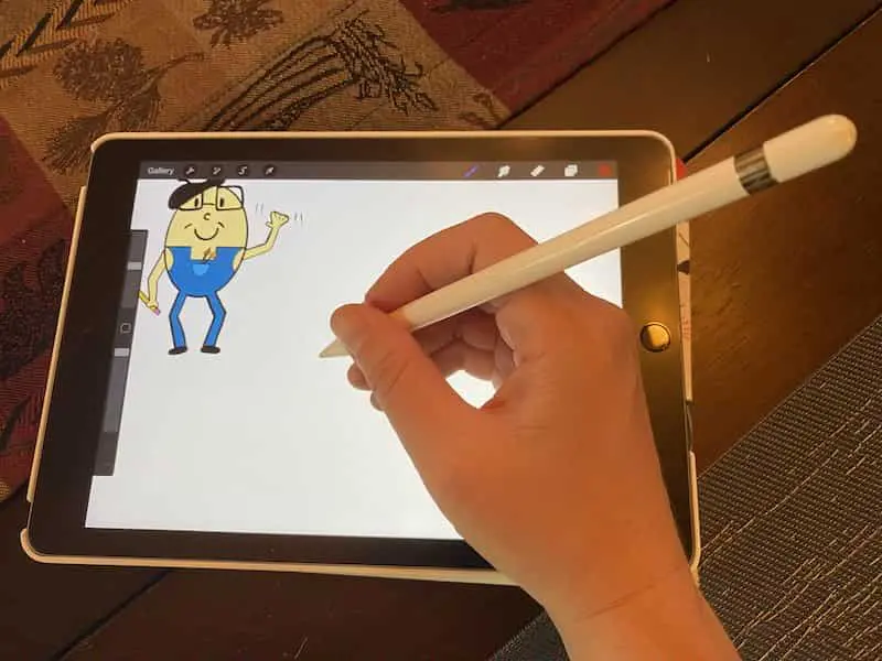 ipad, apple pencil, and procreate with cartoon egg drawing