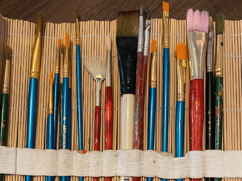 well used collection of paint brushes
