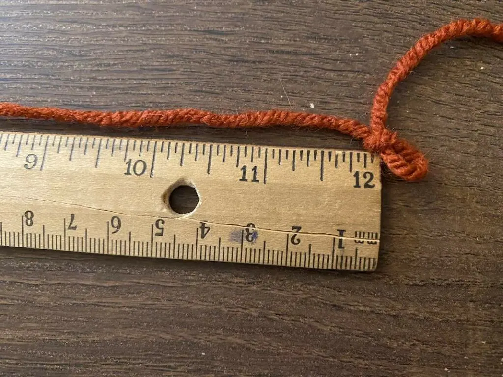yarn with slip knot and ruler