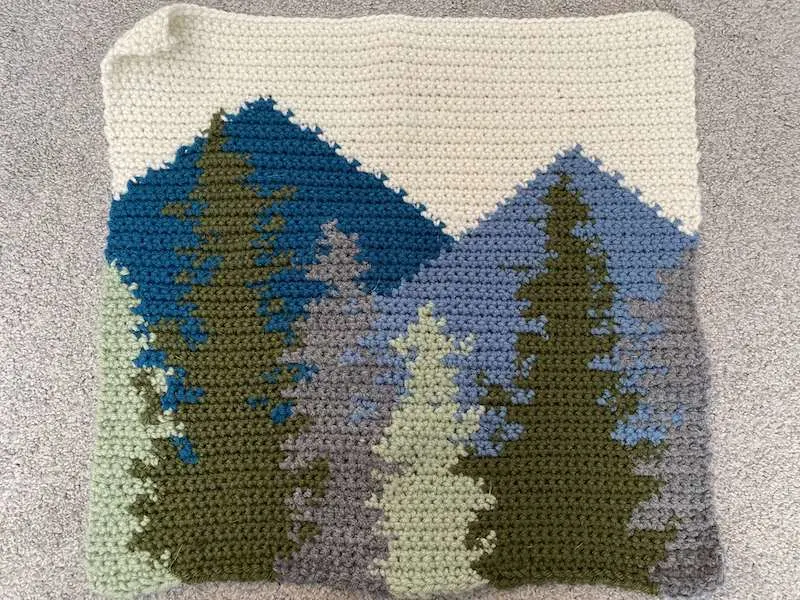 crochet square with forest design