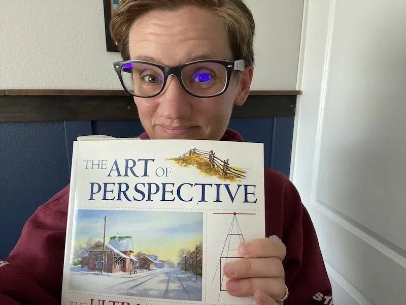 woman with the art of perspective book
