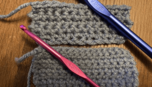 closeup of two swatches of crochet large hook and smaller hook